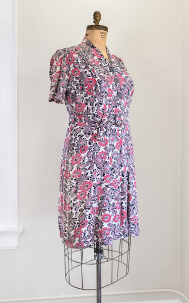 Floral dress on a mannequin against a white wall