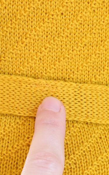 mending on a vintage knit belt