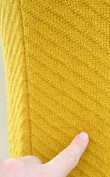 visible mends on a vintage knit sirt