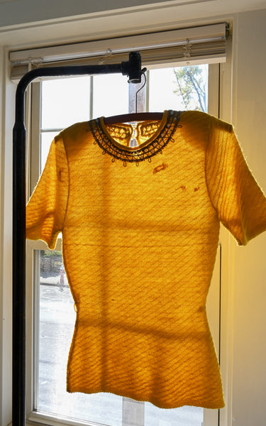 vintage yellow knit top with visible mends