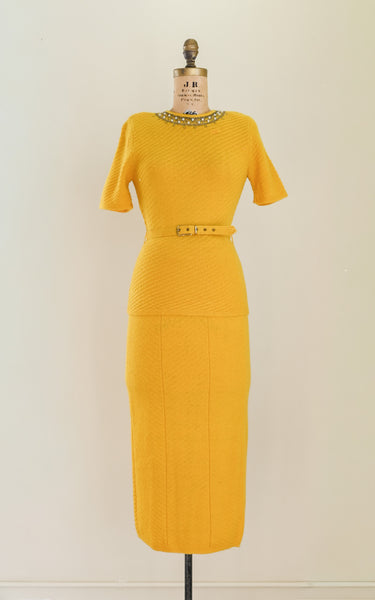 vintage 1930s Yellow knit dress on a mannequin against a plain background