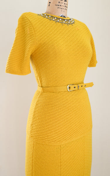 vintage 1930s Yellow knit dress on a mannequin against a plain background